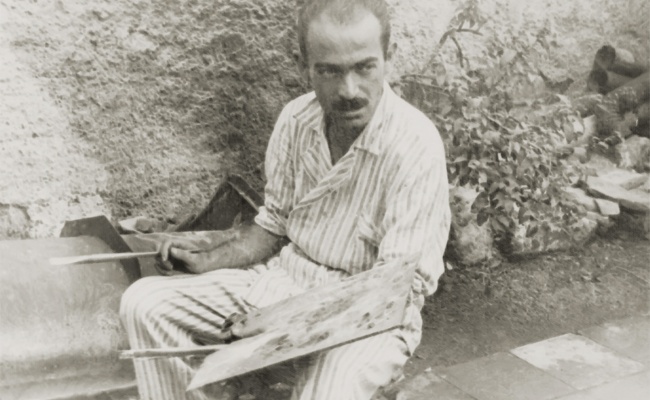 Giovanni Antonio Sulas, in the garden with palette and brushes, 1950s